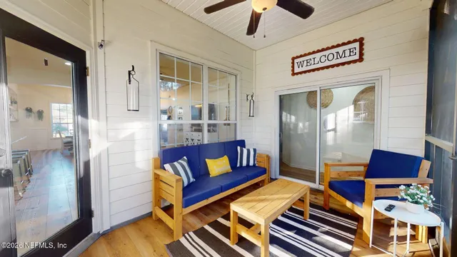 a view of house with backyard and outdoor seating