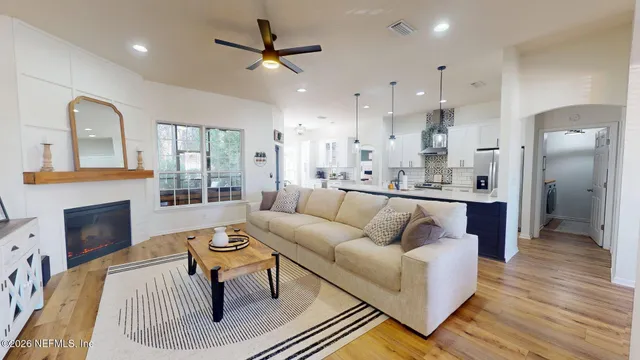 a living room with furniture and a fireplace