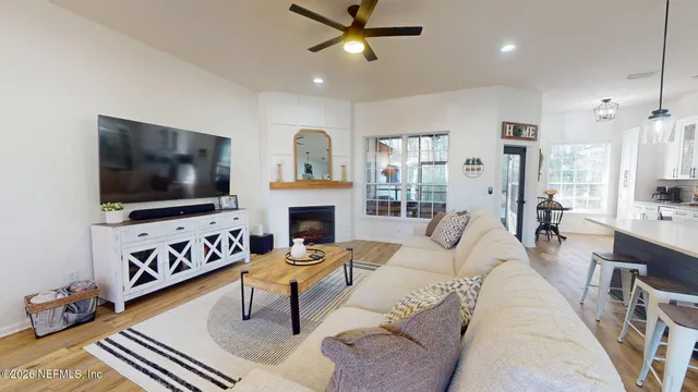a living room with furniture and a flat screen tv
