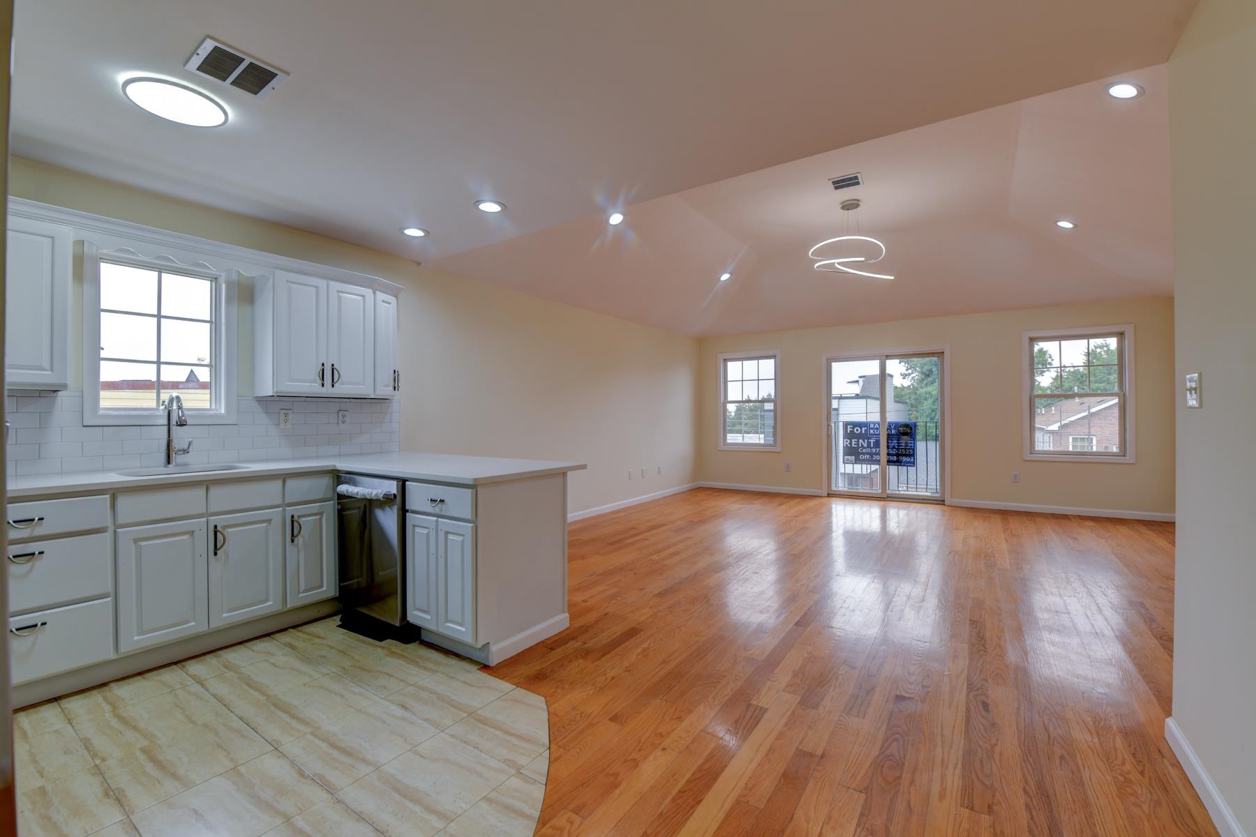 190 Terrace Avenue, Unit 2 Jersey City, NJ 07307 - Photo 1 of 29 a view of a kitchen and window with wooden floor