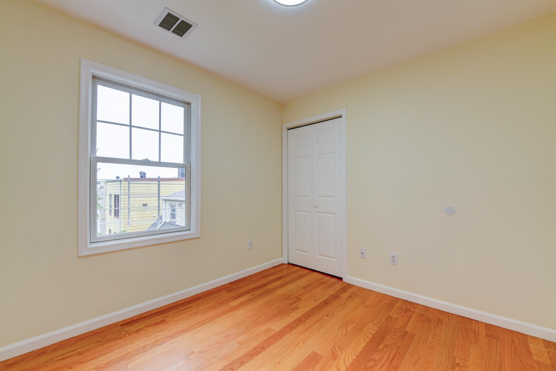 190 Terrace Avenue, Unit 2 Jersey City, NJ 07307 - Photo 17 of 29 an empty room with a window