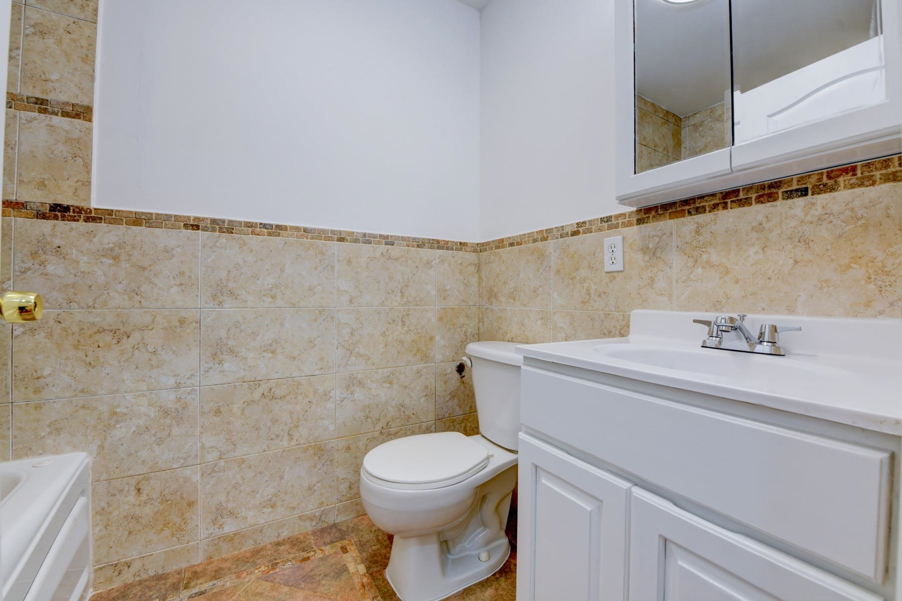 190 Terrace Avenue, Unit 2 Jersey City, NJ 07307 - Photo 23 of 29 a bathroom with a sink a toilet and a mirror