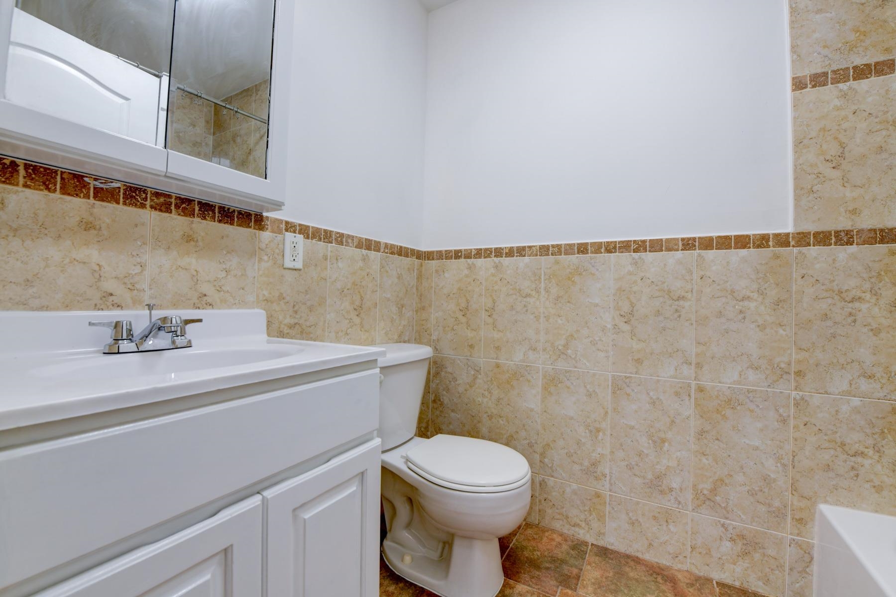190 Terrace Avenue, Unit 2 Jersey City, NJ 07307 - Photo 24 of 29 a bathroom with a sink a toilet and a mirror