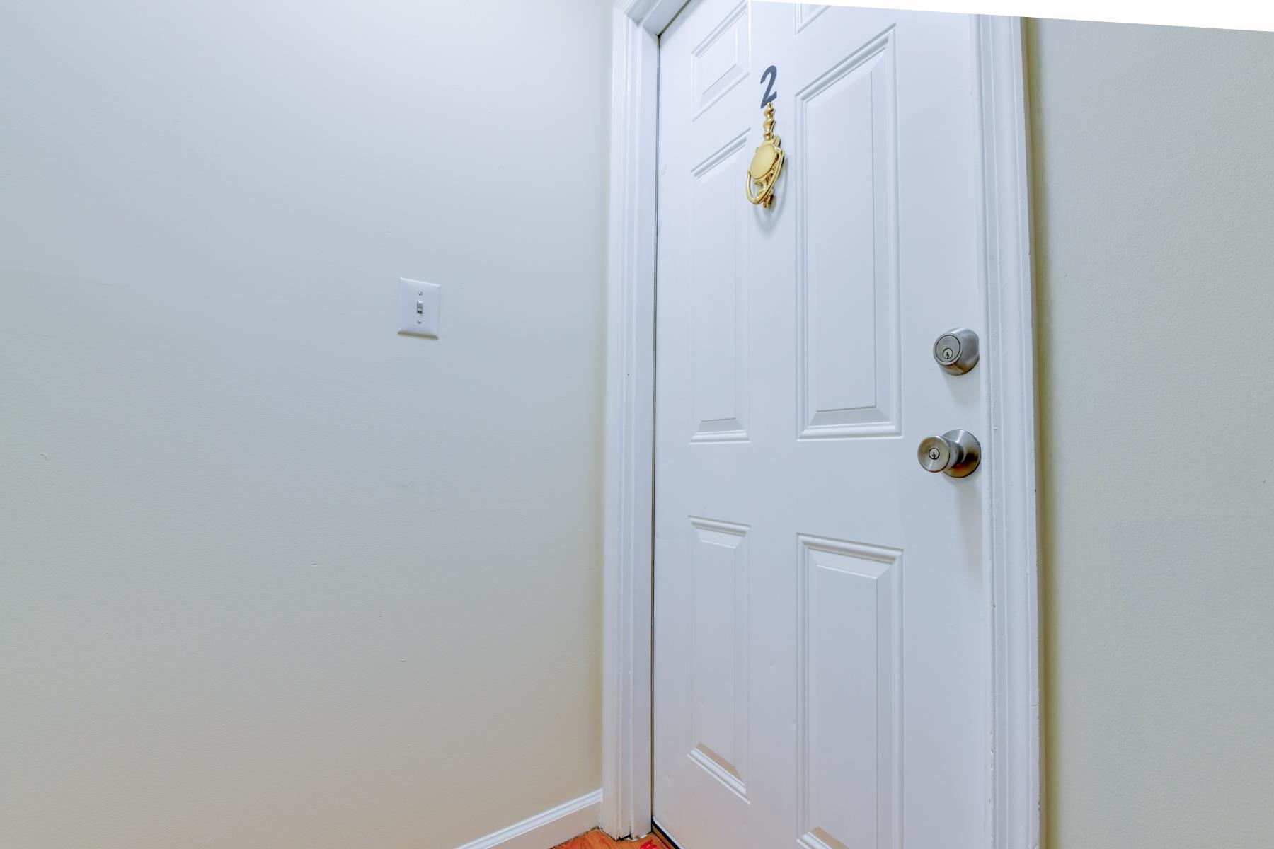 190 Terrace Avenue, Unit 2 Jersey City, NJ 07307 - Photo 25 of 29 a bathroom with a glass shower door