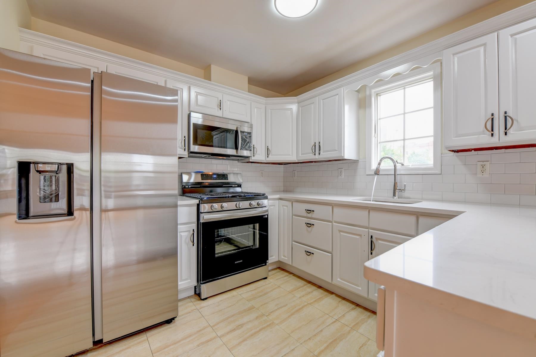 190 Terrace Avenue, Unit 2 Jersey City, NJ 07307 - Photo 28 of 29 a kitchen with a refrigerator stove and microwave