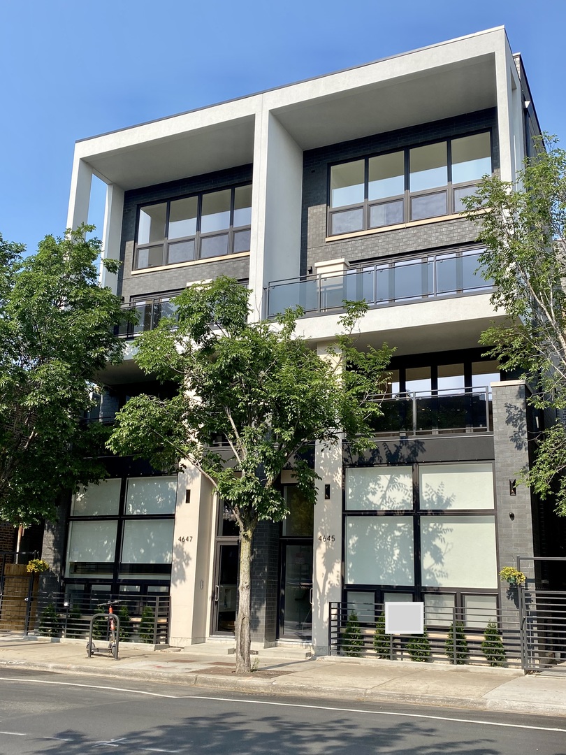 4645 North Clark Street, Unit 2 Chicago, IL 60640 - Photo 1 of 8 a front view of a building with street