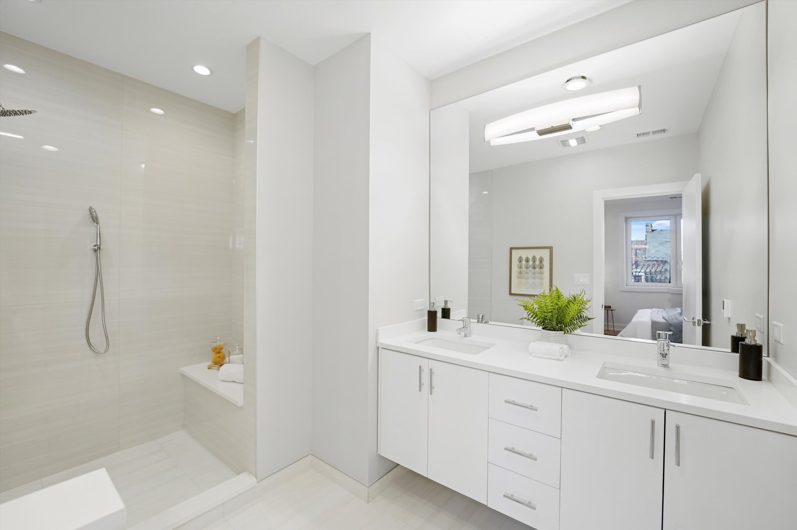 4645 North Clark Street, Unit 2 Chicago, IL 60640 - Photo 8 of 8 a bathroom with a double vanity sink mirror and bathtub