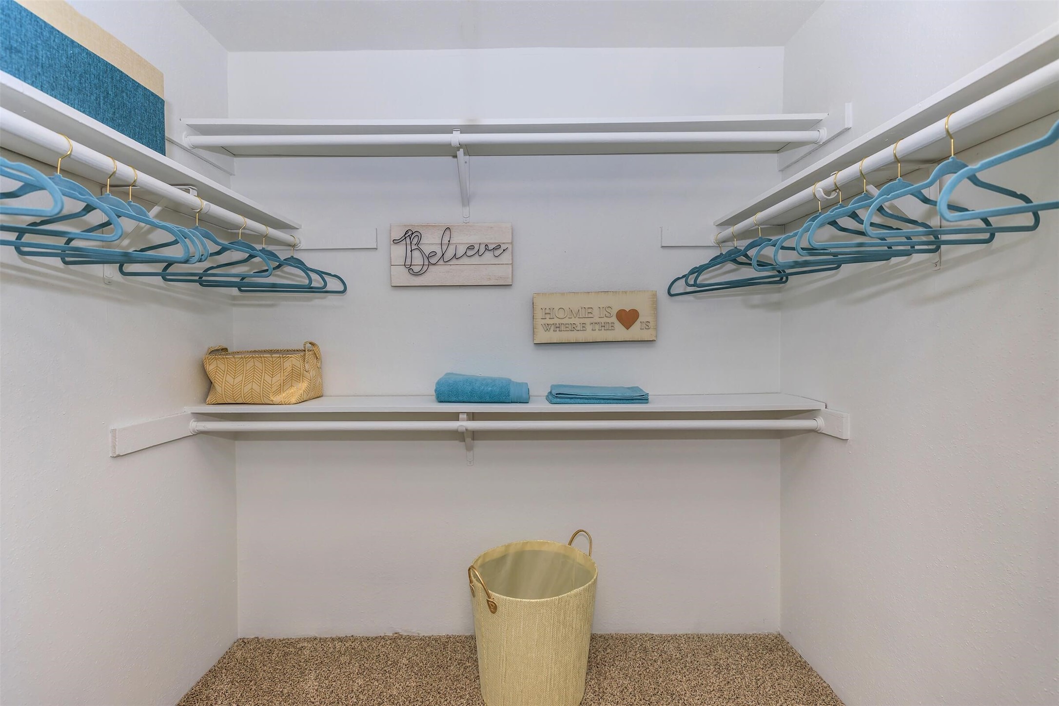 265 El Dorado Boulevard, Unit 1505 Webster, TX 77598 - Photo 8 of 29 a shelf with a vase and flowers on it