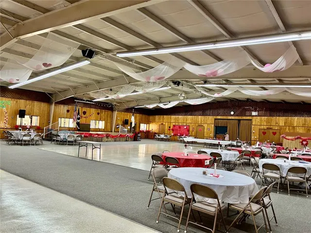a view of a house with a yard and sitting area