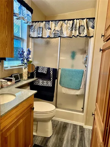 a bedroom with a bed and a mirror