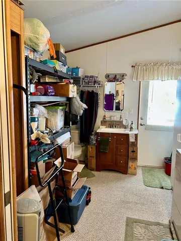 a view of a livingroom with furniture and a ceiling fan
