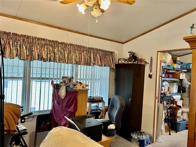 a living room with furniture a rug and a chandelier