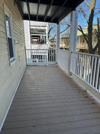 a view of an entryway with wooden floor