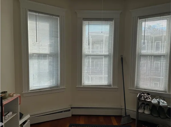 a view of an empty room with a window