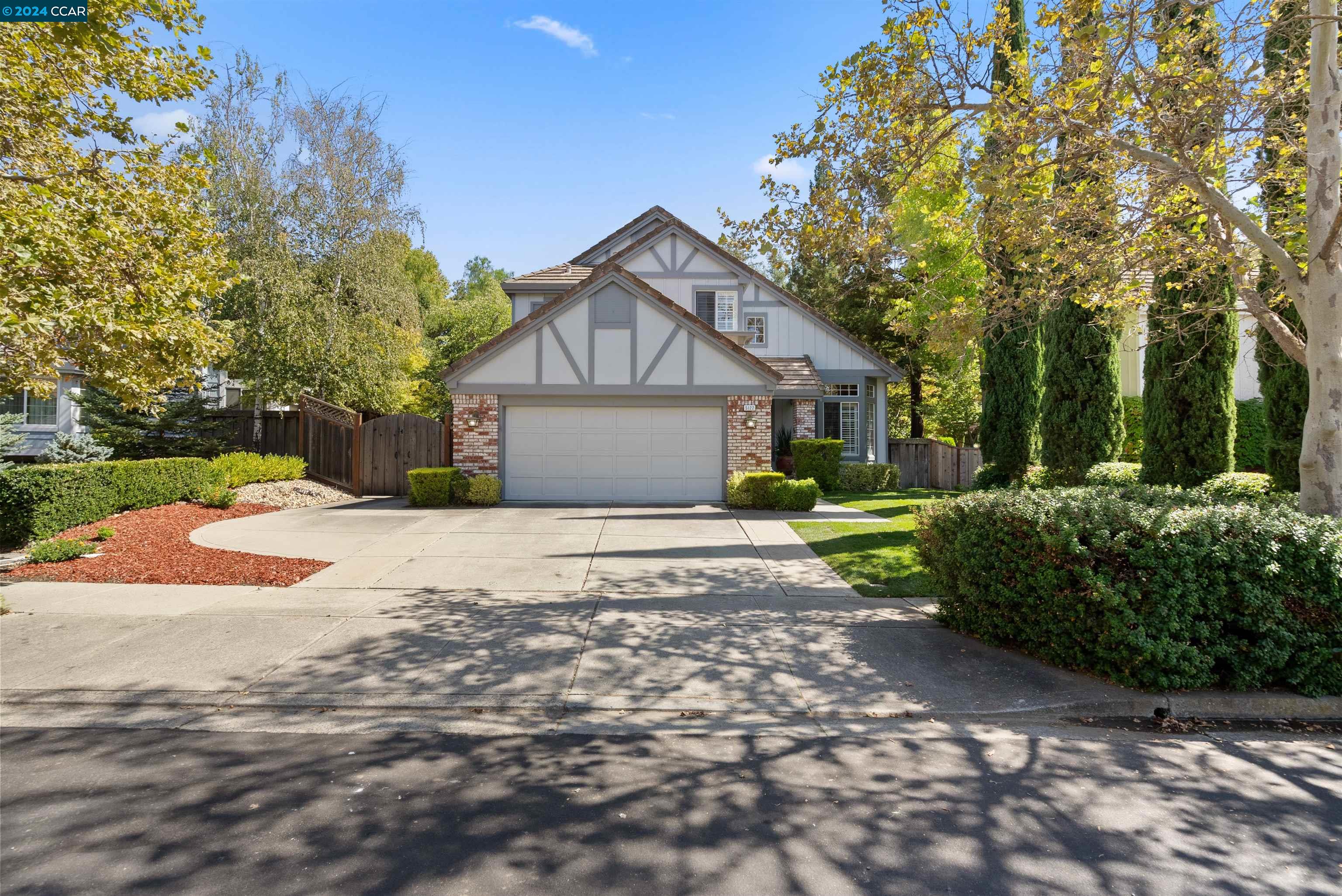 5122 Keller Ridge Drive Clayton, CA 94517 - Photo 1 of 1 a front view of a house with a yard and garage