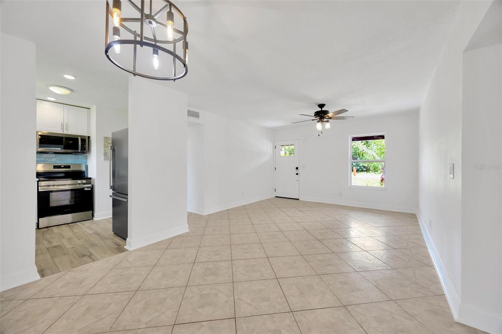 9935 River Drive Gibsonton, FL 33534 - Photo 11 of 29 an empty room with windows and ceiling fan