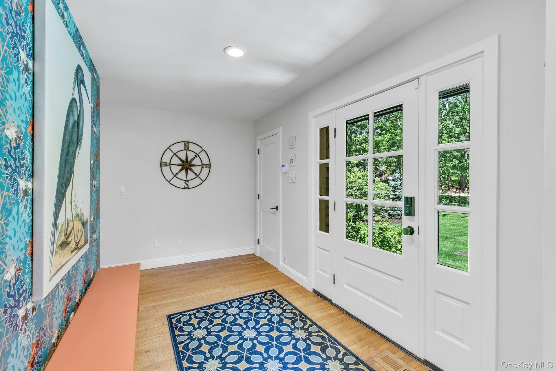 16 Hildreth Road Hampton Bays, NY 11946 - Photo 8 of 29 a view of a hallway to a bedroom with wooden floor and a window
