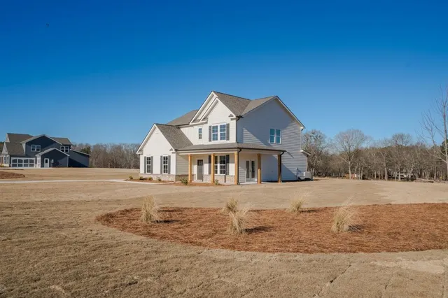 a front view of a house with a yard
