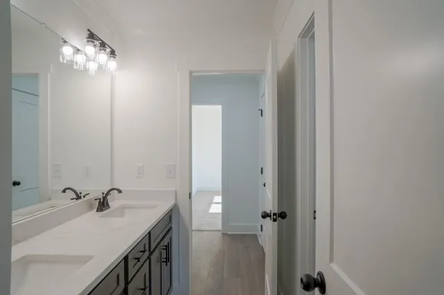 an empty room with closet and windows