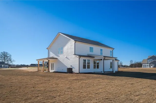 a view of a house with a road