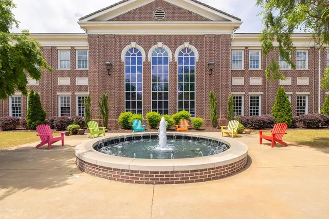 a view of a building with sitting area