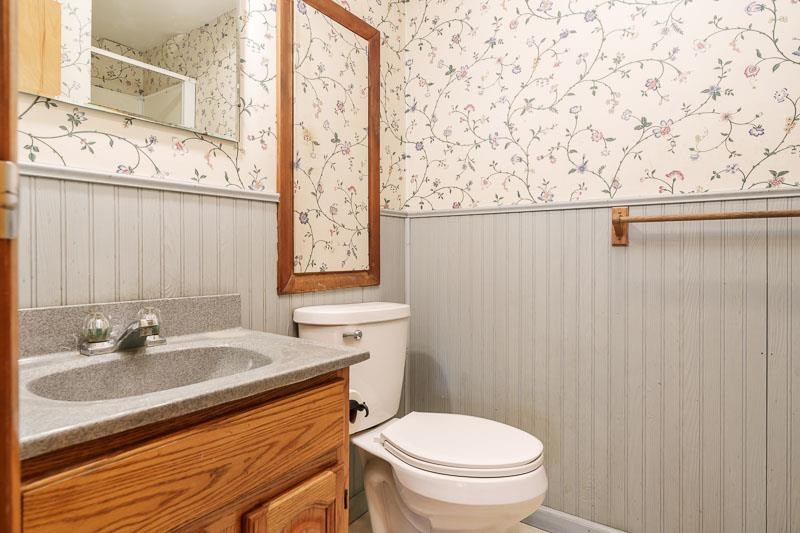 2686 Lundgren Road Pecatonica, IL 61063 - Photo 26 of 58 a bathroom with a sink a toilet and shower curtain
