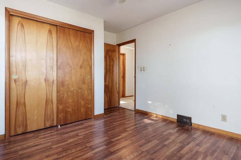 2686 Lundgren Road Pecatonica, IL 61063 - Photo 29 of 58 an empty room with wooden floor and closet