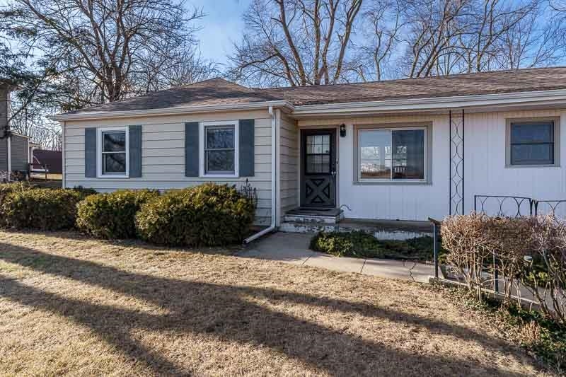 2686 Lundgren Road Pecatonica, IL 61063 - Photo 3 of 58 a front view of a house with garden