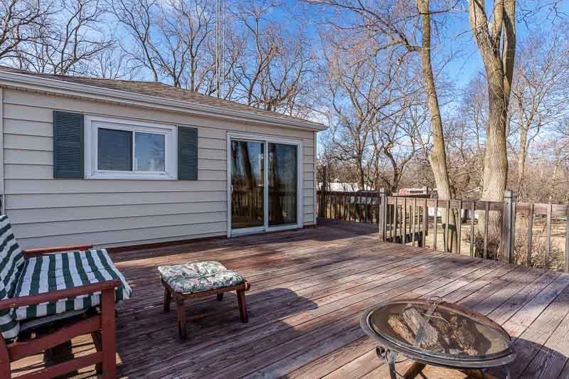 2686 Lundgren Road Pecatonica, IL 61063 - Photo 39 of 58 a backyard of a house with barbeque oven table and chairs