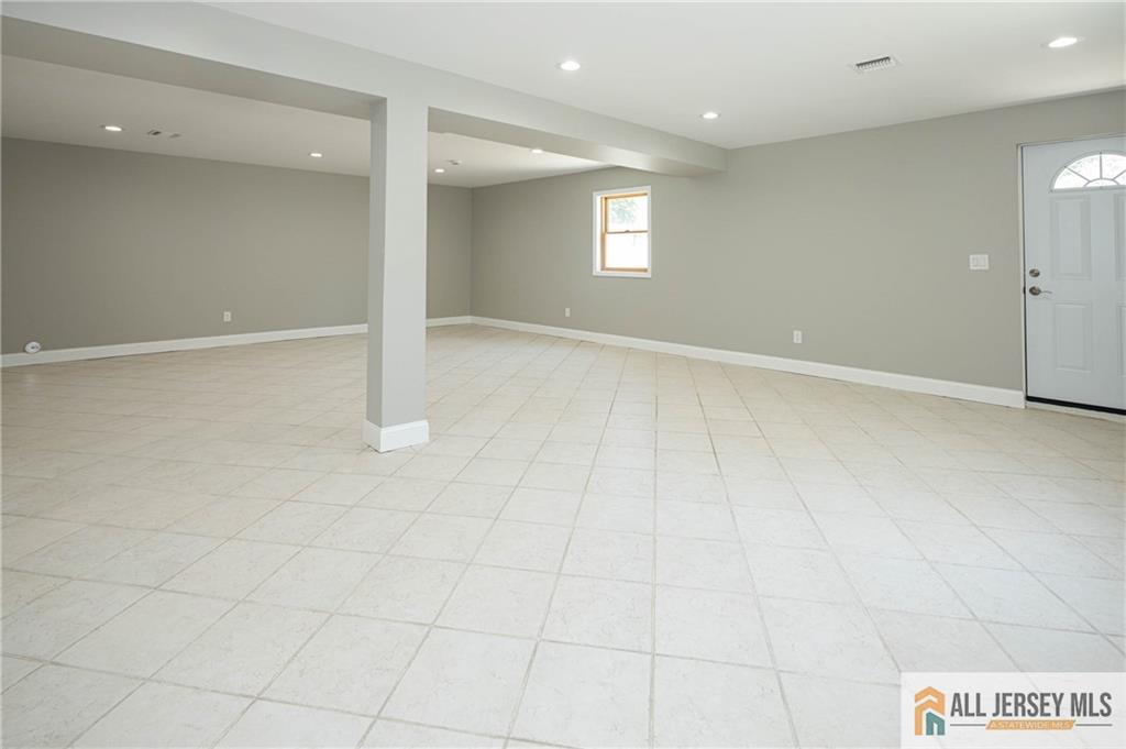 278 Rector Street Perth Amboy, NJ 08861 - Photo 30 of 47 an empty room with white walls and windows