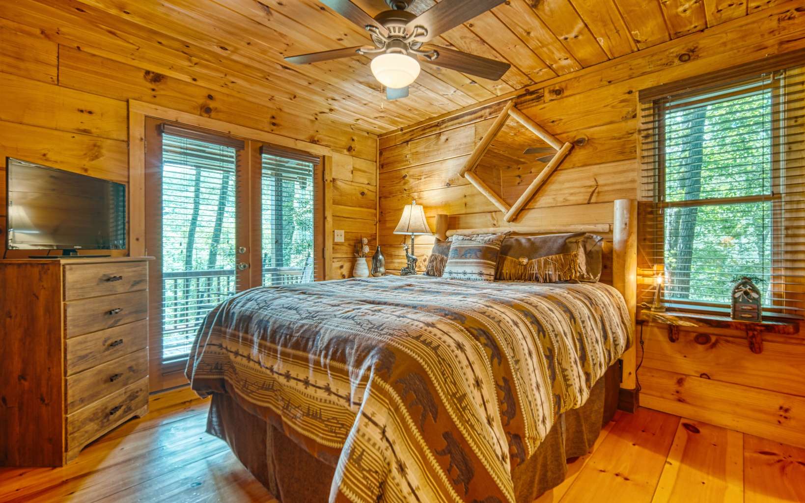 206 Mountain View Road Cherry Log, GA 30522 - Photo 24 of 49 a bedroom with a bed closet and flat tv screen