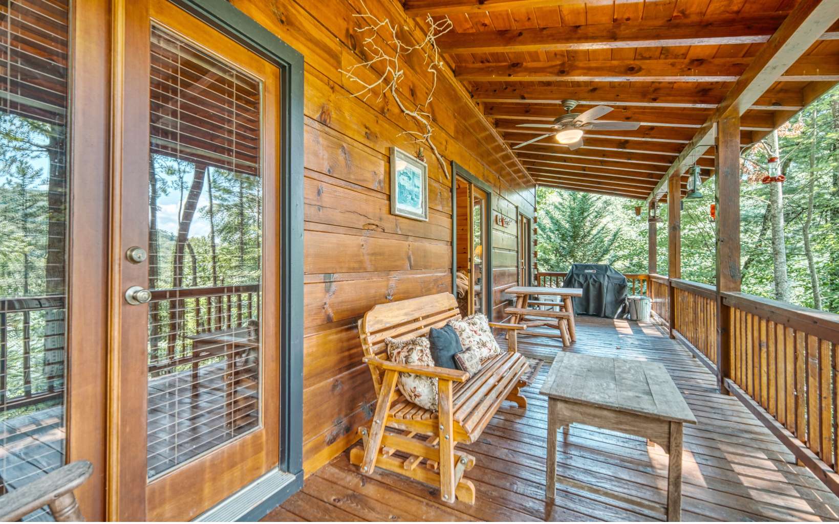 206 Mountain View Road Cherry Log, GA 30522 - Photo 33 of 49 a view of a patio with a table chairs and wooden floor