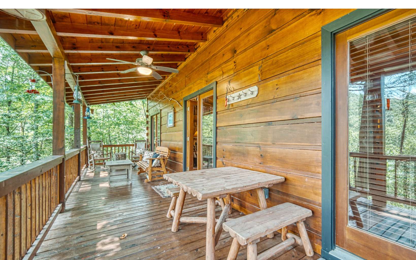 206 Mountain View Road Cherry Log, GA 30522 - Photo 35 of 49 a view of balcony with wooden floor and outdoor seating