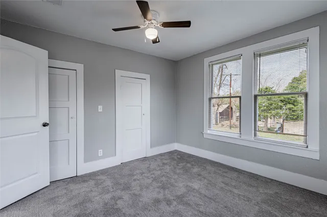 a big room with windows and closet