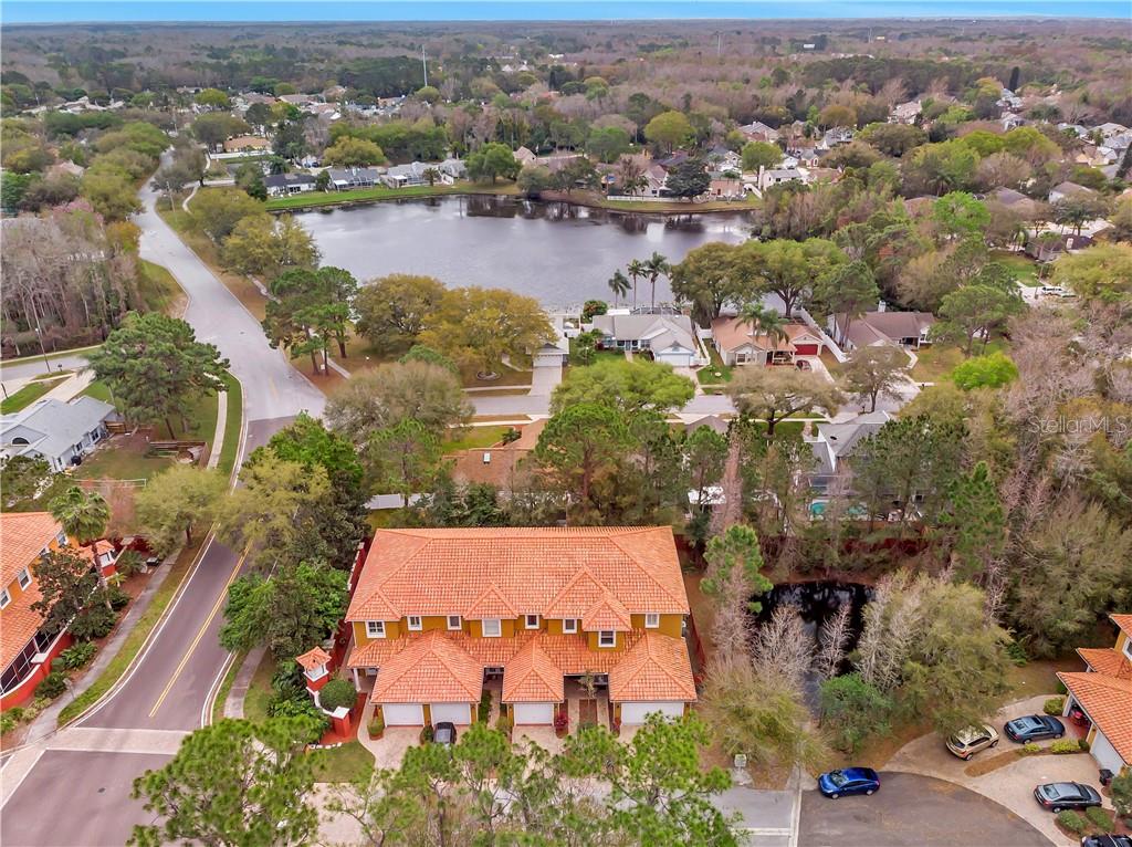 7406 Newburns Place New Port Richey, FL 34655 - Photo 1 of 1 an aerial view of a city with lots of residential buildings