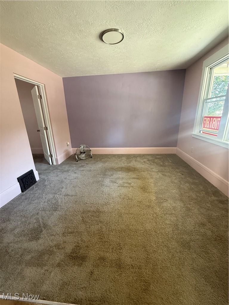 746 Wooster Road North Barberton, OH 44203 - Photo 12 of 44 Empty room with a textured ceiling and carpet floors