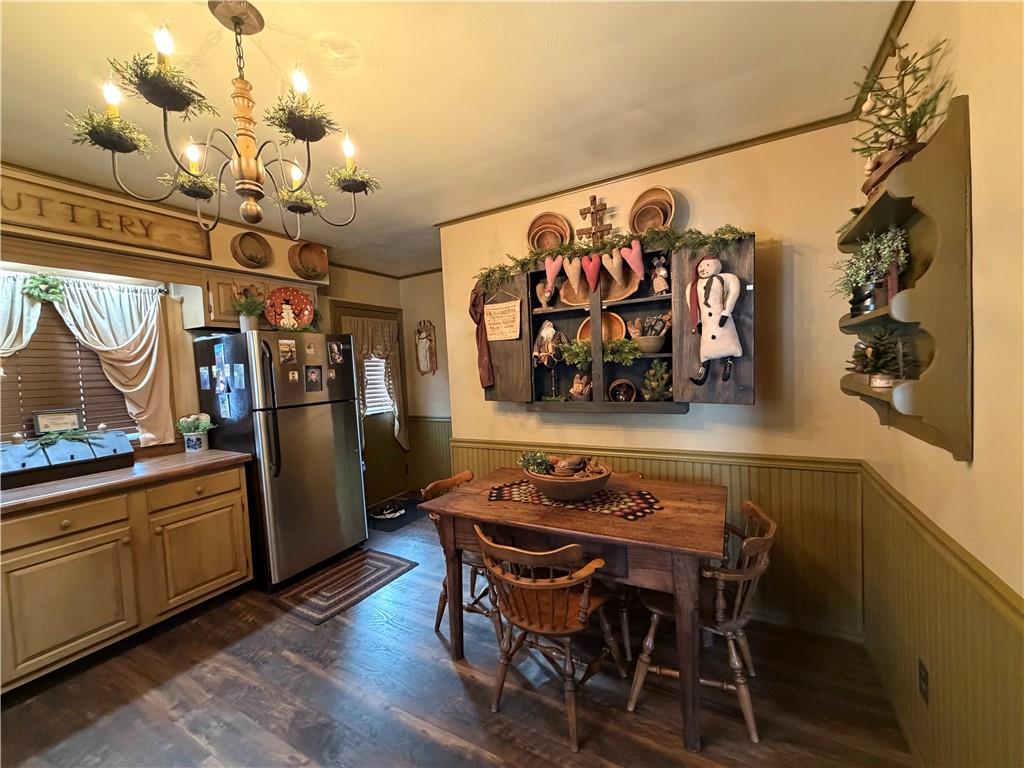 3070 Spangler Road West Middlesex, PA 16159 - Photo 15 of 22 a view of a dining room with furniture and chandelier