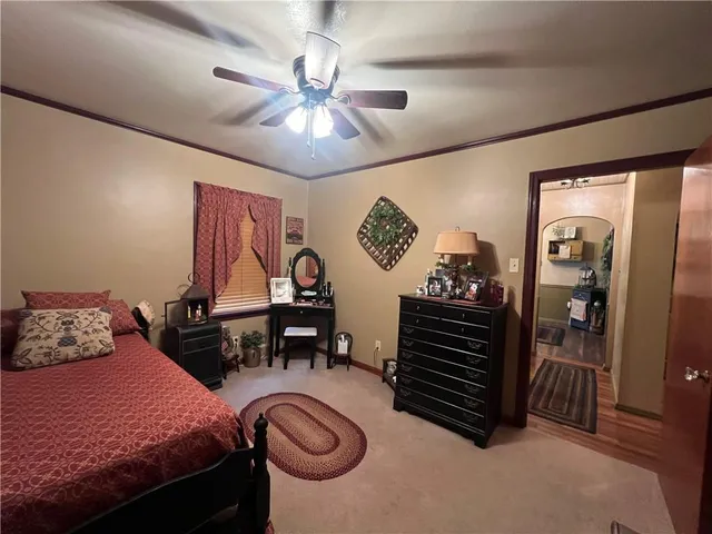 a bedroom with furniture and a chandelier