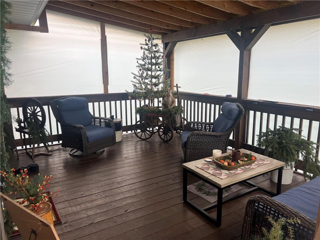 3070 Spangler Road West Middlesex, PA 16159 - Photo 4 of 22 a dining room with wooden floor a glass table and chairs