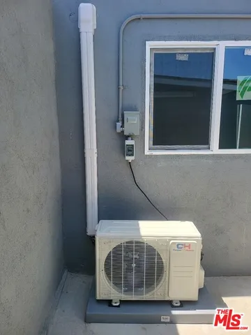 a room with a table and a potted plant