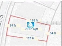 a picture of a book shelf with a white comforter