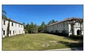 a view of a house with backyard