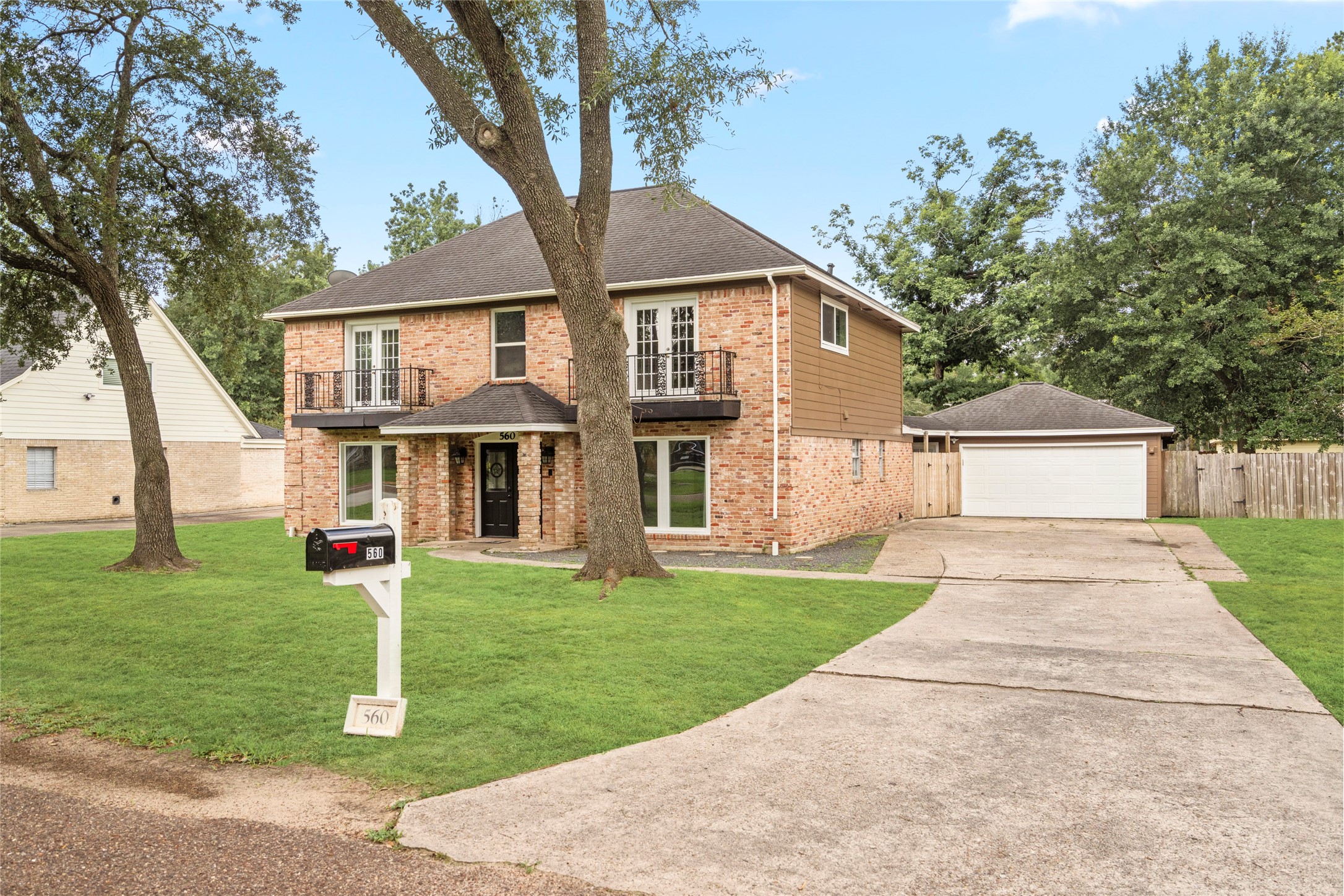 560 Landfall Lane Conroe, TX 77302 - Photo 41 of 41
Long driveway with ample space for cars and an oversized two-car garage,