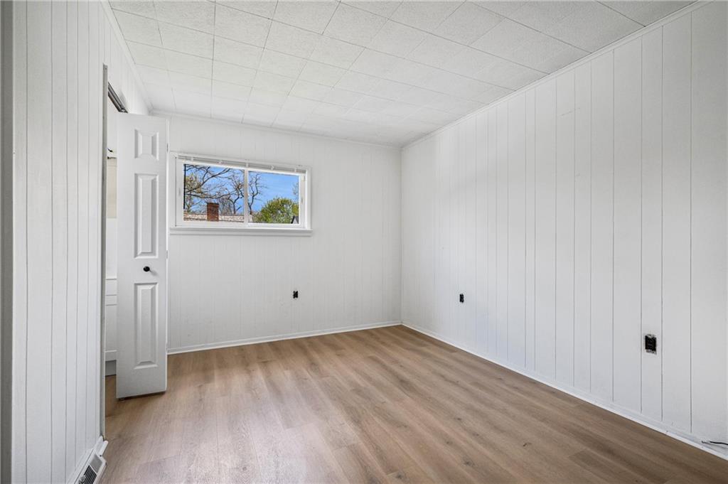 1716 Davidson Street Aliquippa, PA 15001 - Photo 15 of 34 a view of an empty room with wooden floor and closet