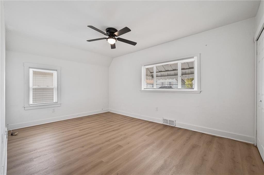 1716 Davidson Street Aliquippa, PA 15001 - Photo 19 of 34 a view of empty room with wooden floor and fan