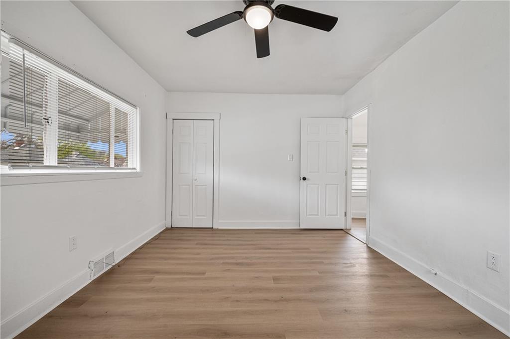 1716 Davidson Street Aliquippa, PA 15001 - Photo 20 of 34 a view of an empty room with wooden floor and a window