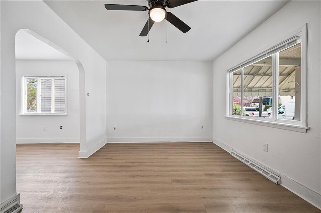 1716 Davidson Street Aliquippa, PA 15001 - Photo 3 of 34 wooden floor in an empty room with a window
