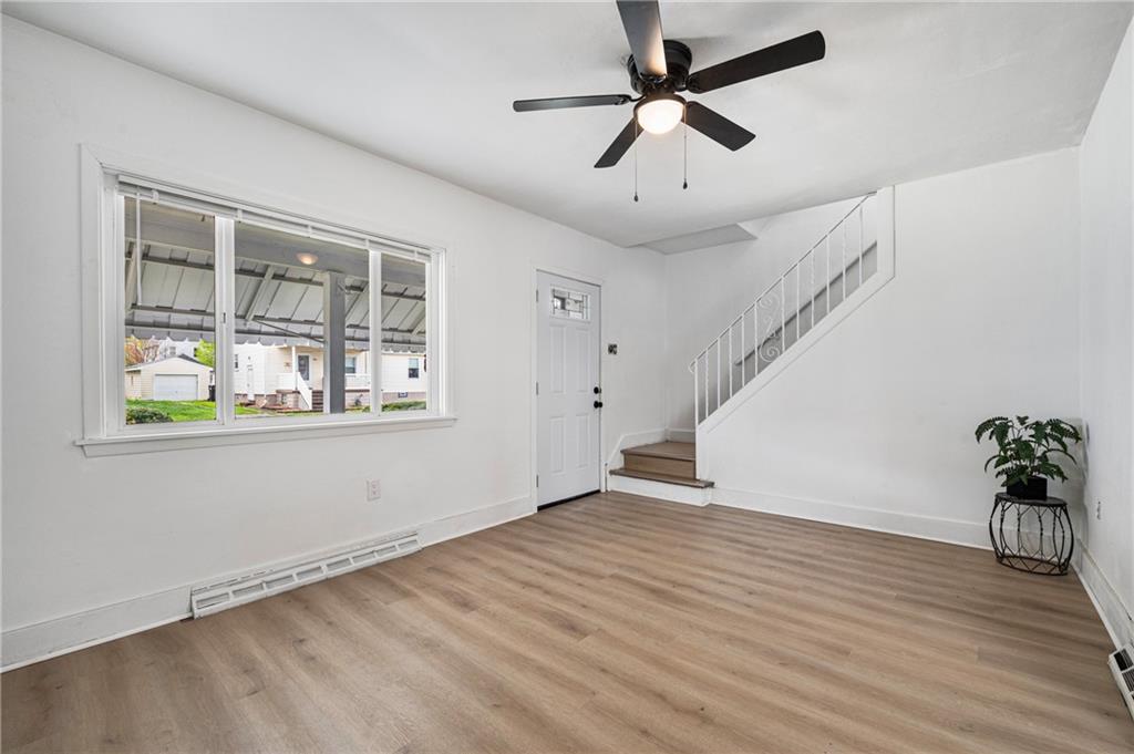 1716 Davidson Street Aliquippa, PA 15001 - Photo 4 of 34 wooden floor in an empty room with a window