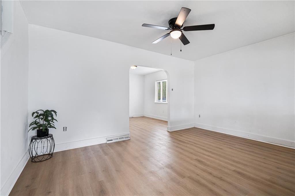 1716 Davidson Street Aliquippa, PA 15001 - Photo 5 of 34 wooden floor in an empty room with a window