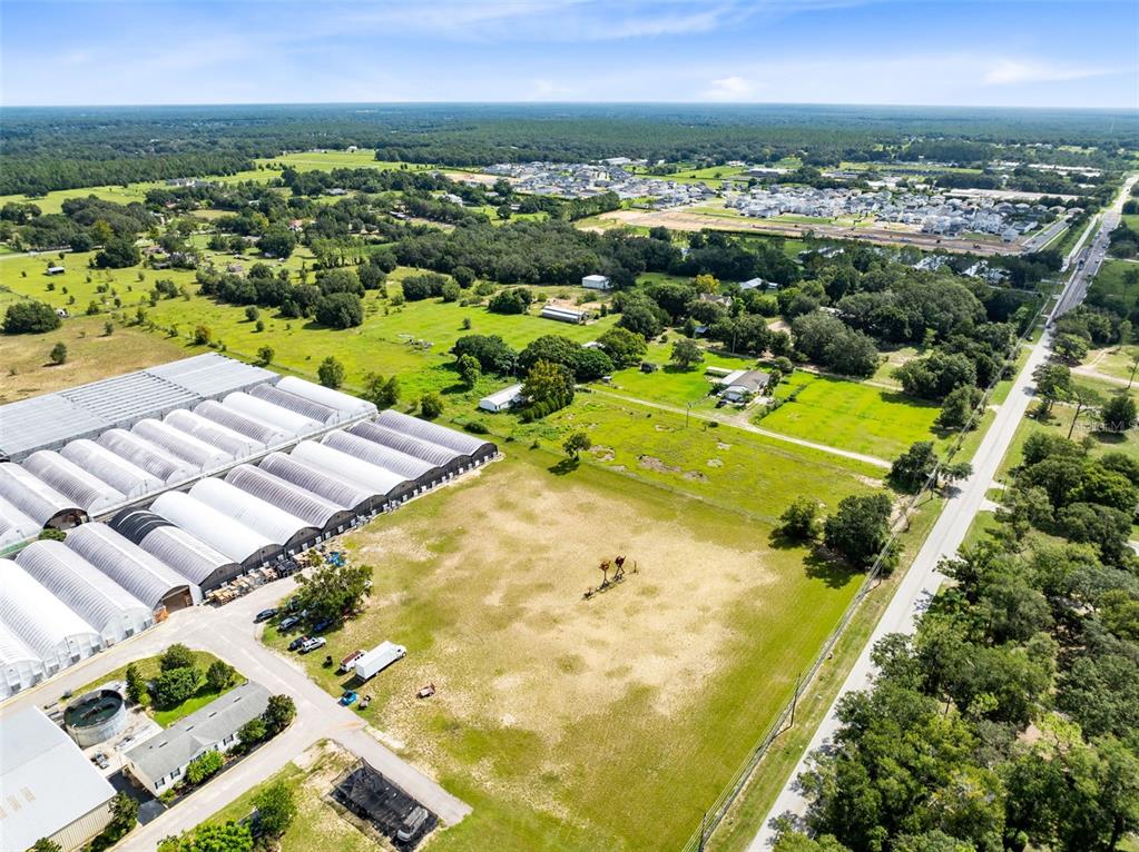 2719 West Kelly Park Road Apopka, FL 32712 - Photo 20 of 22 an aerial view of residential houses with outdoor space and swimming pool
